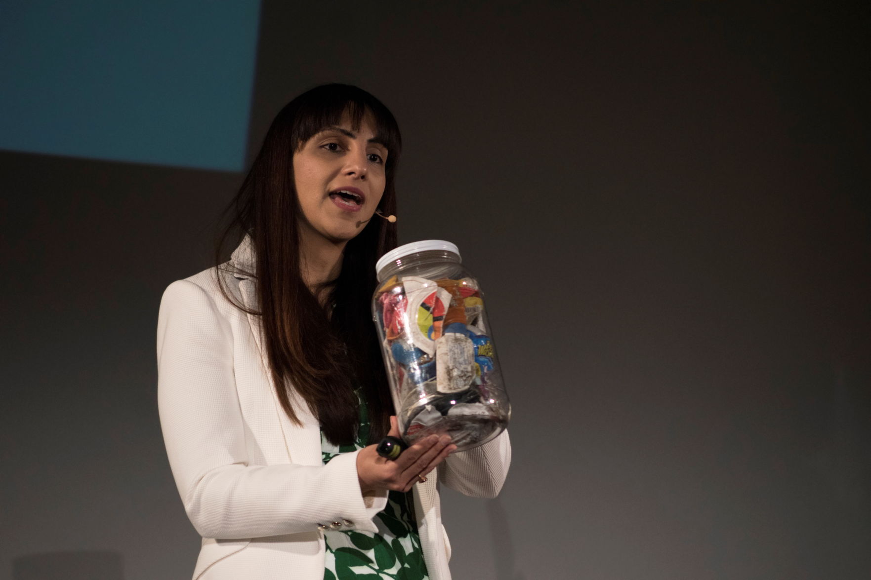 Priyanka Bakaya holds a jar of mixed recyclables as she speaks at the 2015 TEDx Amherst event at the University of Massachusetts